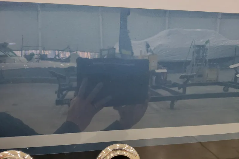 Slide: The Image of Reflection on 2026 Formula 400 Super Sport Crossover in a showroom setting. - 5