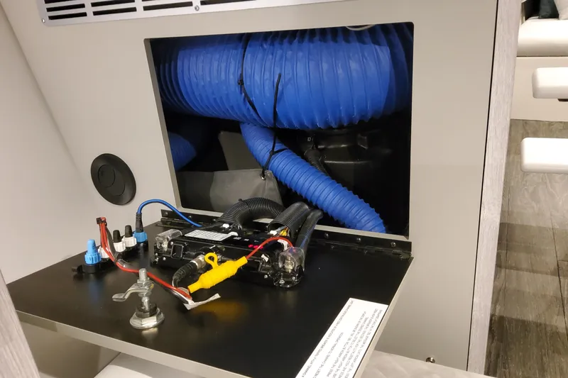 Slide: The Image of Interior view of 2026 Formula 400 Super Sport Crossover, showcasing electrical components and blue ductwork. - 51