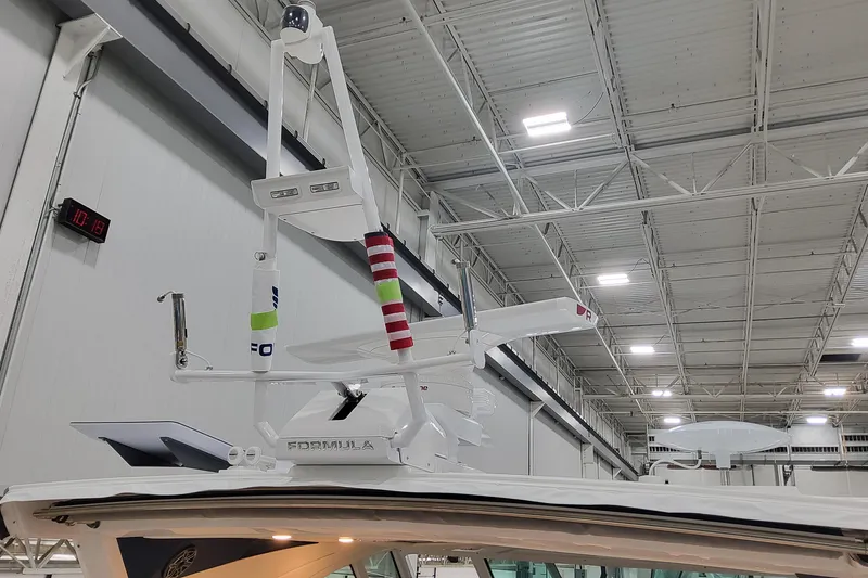 Slide: The Image of 2026 Formula 400 Super Sport Crossover boat radar and antenna system in a warehouse. - 52