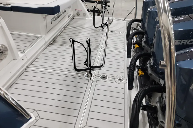 Slide: The Image of 2026 Formula 400 Super Sport Crossover boat deck with Mercury engines and sleek design. - 6