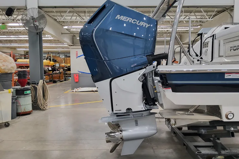 Slide: The Image of 2026 Formula 400 Super Sport Crossover with Mercury outboard engine in a workshop. - 9