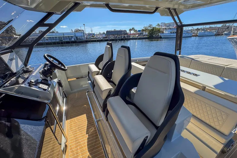 Slide: The Image of Interior of 2026 De Antonio Yachts D32, featuring sleek seating and modern controls. - 20