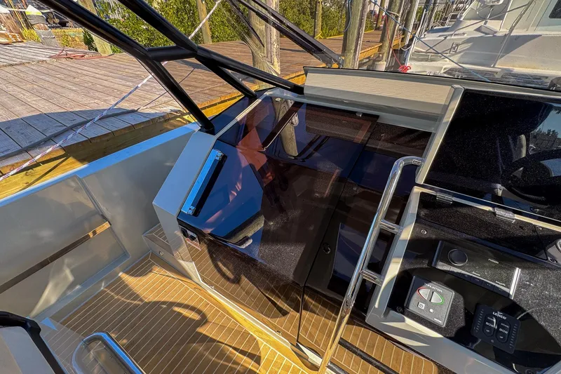 Slide: The Image of 2026 De Antonio Yachts D32 cockpit with modern controls and sleek design. - 24