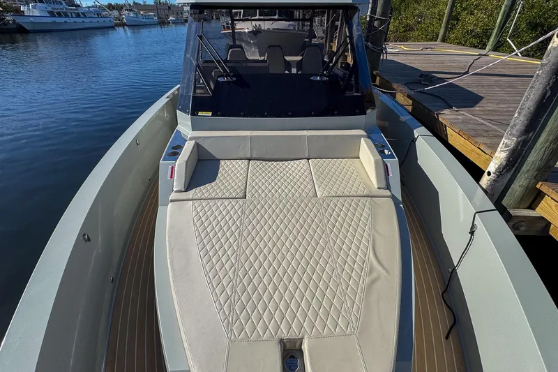 Slide: The Image of 2026 De Antonio Yachts D32 with elegant deck design, docked by the water. - 36