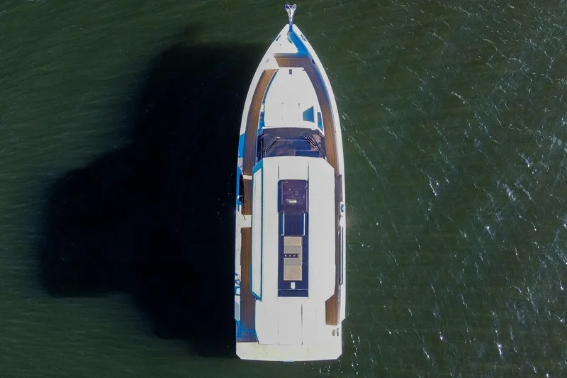 Slide: The Image of Aerial view of 2026 De Antonio Yachts D32 on water, showcasing sleek design. - 5