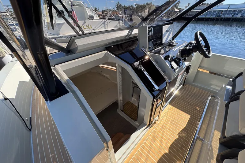 Slide: The Image of 2026 De Antonio Yachts D32 cockpit with modern helm and cabin entrance. - 25