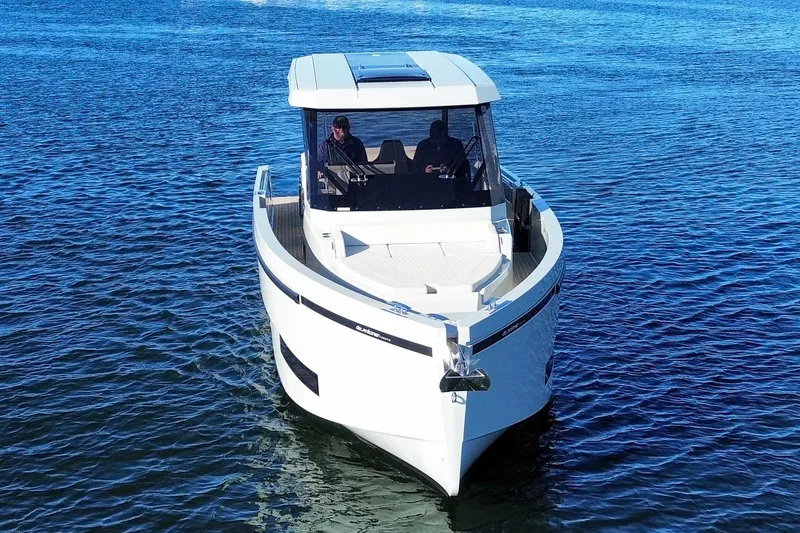 Slide: The Image of 2026 De Antonio Yachts D32 cruising on open water, showcasing sleek design and modern features. - 3