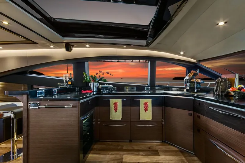 Slide: The Image of Manufacturer Provided Image: Luxurious kitchen interior of 2016 Sea Ray L650 yacht with sunset view. - 2
