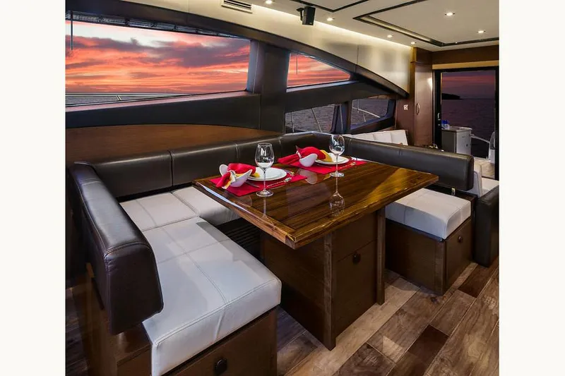 Slide: The Image of Manufacturer Provided Image: Luxurious dining area on 2016 Sea Ray L650 yacht with sunset view. - 4