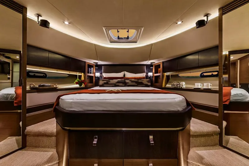 Slide: The Image of Manufacturer Provided Image: Luxurious master bedroom in 2016 Sea Ray L650 yacht with modern decor and ambient lighting. - 5