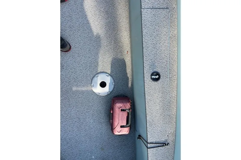 Slide: The Image of 2024 Starcraft Patriot 16 SC boat interior with storage compartment and tackle box. - 6