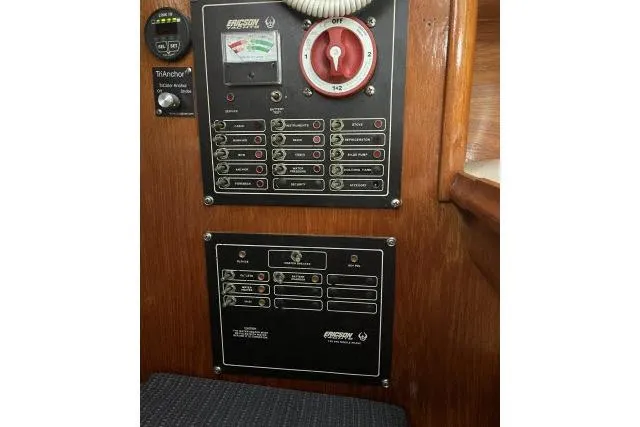Slide: The Image of Electrical control panel on 1983 Ericson 381 sailboat, featuring switches and gauges. - 12