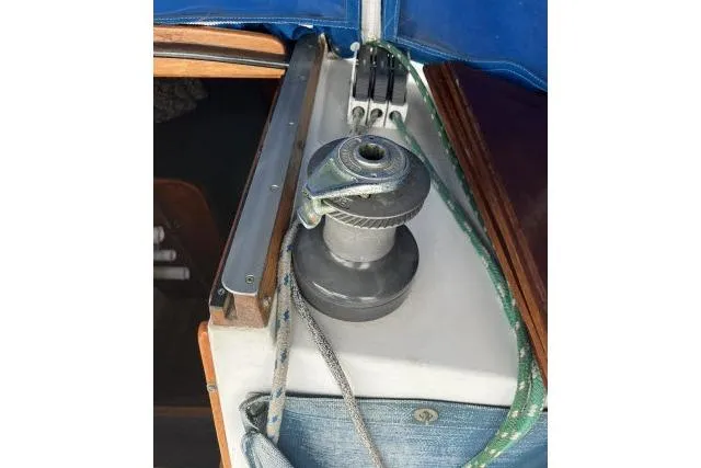 Slide: The Image of Winch on 1983 Ericson 381 sailboat with ropes and blue cover. - 22