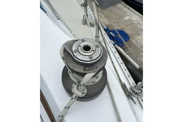 Slide: The Image of Winch on 1983 Ericson 381 sailboat deck with rope coiled around. - 25