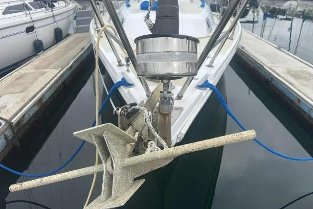 Slide: The Image of Bow of 1983 Ericson 381 sailboat with anchor and docked in marina. - 27