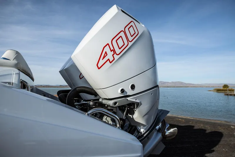 Slide: The Image of 2026 Statement 350 Open boat with powerful 400 horsepower engine by the water. - 10