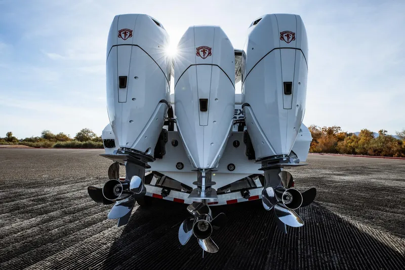 Slide: The Image of Rear view of 2026 Statement 350 Open boat engines on a trailer. - 11
