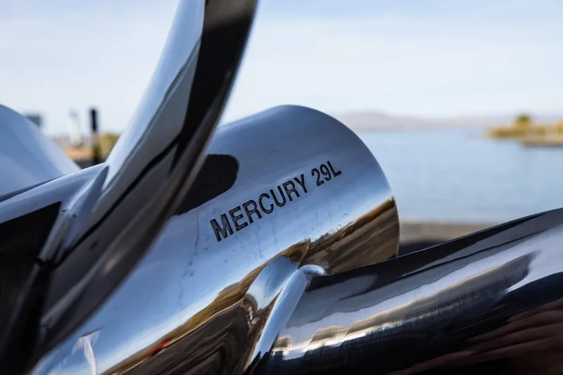 Slide: The Image of Close-up of Mercury 29L propeller on Statement 350 Open, 2026 model, near water. - 16