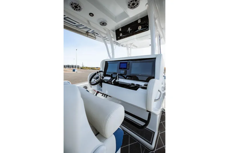 Slide: The Image of 2026 Statement 350 Open boat cockpit with modern navigation displays and steering wheel. - 20