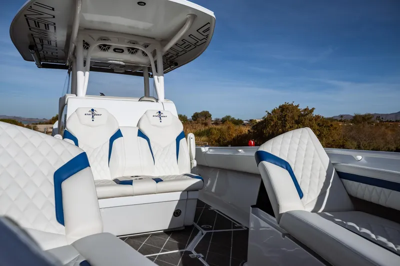 Slide: The Image of Luxury seating on 2026 Statement 350 Open boat, featuring white and blue upholstery. - 21