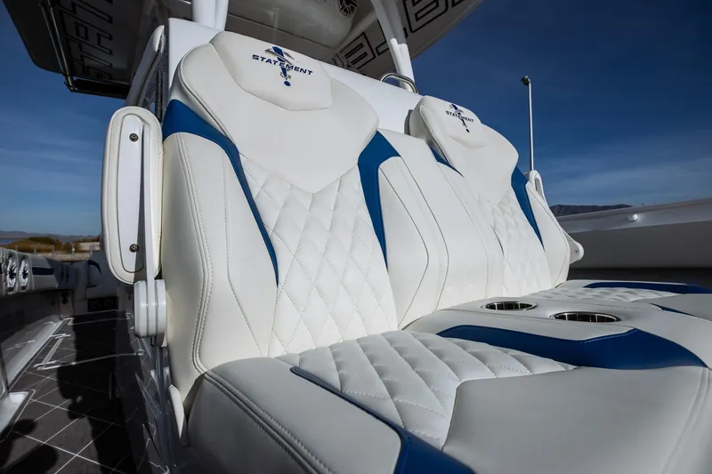 Slide: The Image of Luxurious seating on 2026 Statement 350 Open boat, featuring white and blue upholstery. - 22