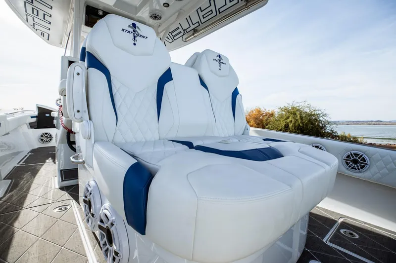 Slide: The Image of Luxurious seating on 2026 Statement 350 Open boat with white and blue upholstery. - 34
