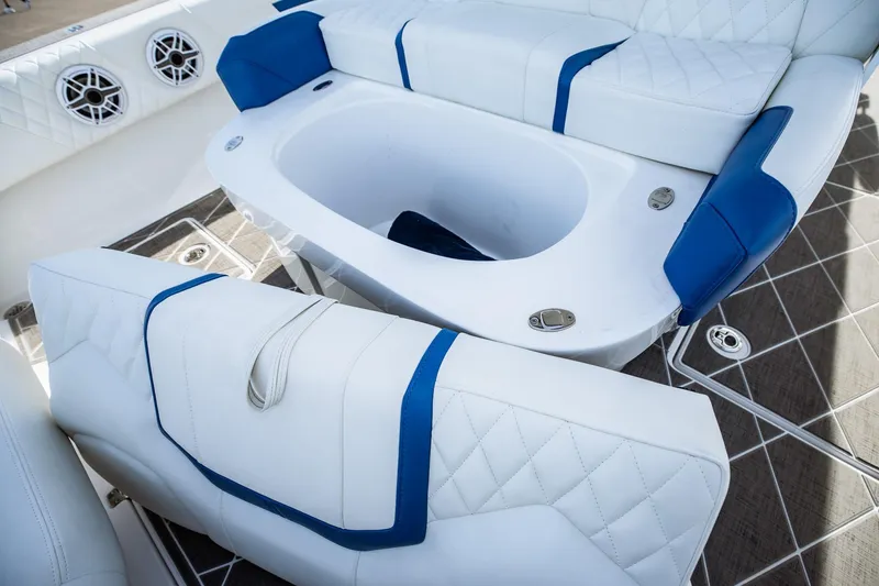 Slide: The Image of Luxury seating on 2026 Statement 350 Open boat with blue accents and integrated speakers. - 37
