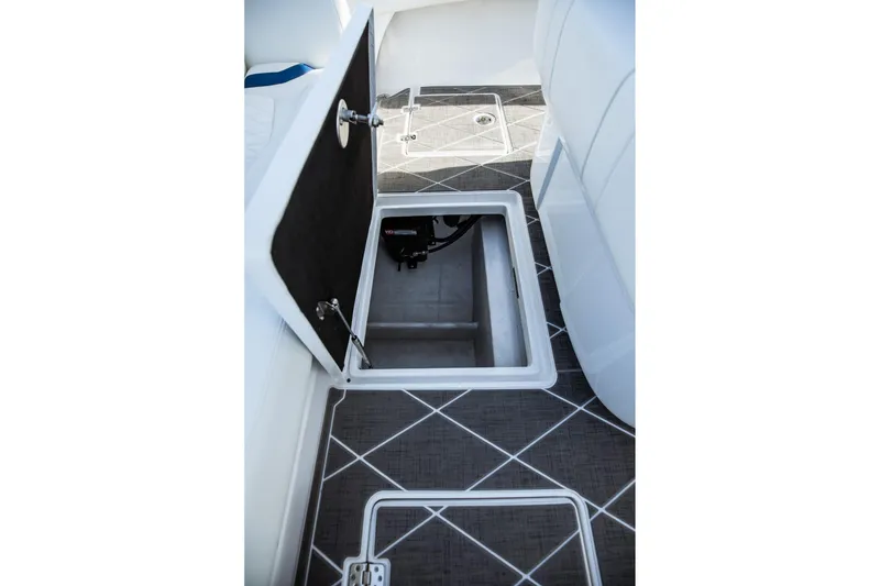 Slide: The Image of 2026 Statement 350 Open boat storage compartment with open hatch on patterned deck. - 38