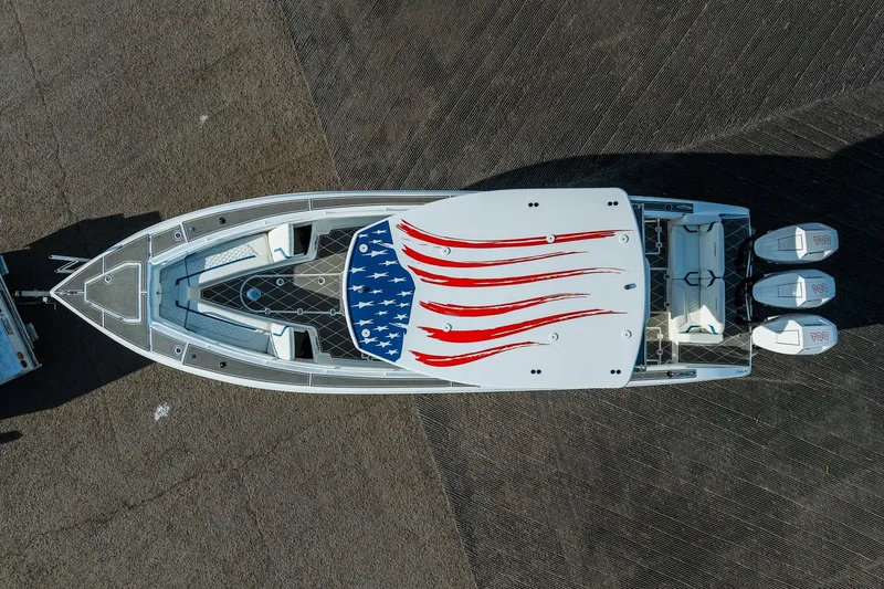 Slide: The Image of Aerial view of 2026 Statement 350 Open boat with American flag design on deck. - 4