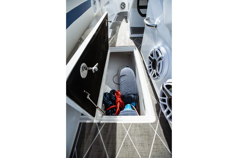 Slide: The Image of Open storage compartment on 2026 Statement 350 Open boat with ropes and fender. - 40