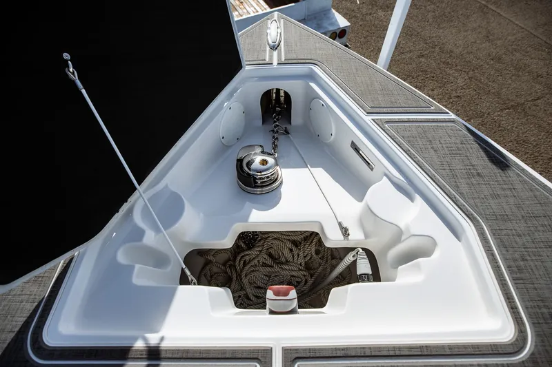 Slide: The Image of Anchor storage compartment on 2026 Statement 350 Open boat, featuring ropes and winch. - 43