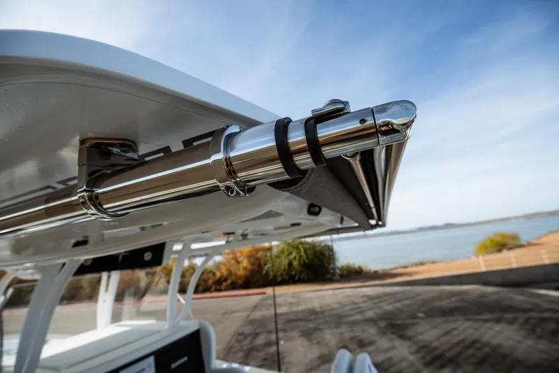 Slide: The Image of Close-up of 2026 Statement 350 Open boat's polished metal fixture by the water. - 44