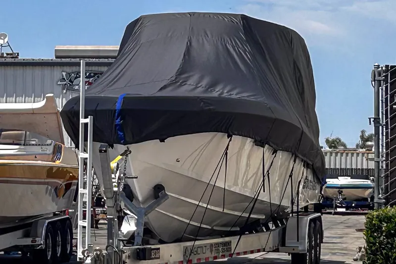 Slide: The Image of Covered 2026 Statement 350 Open boat on trailer in storage facility. - 46
