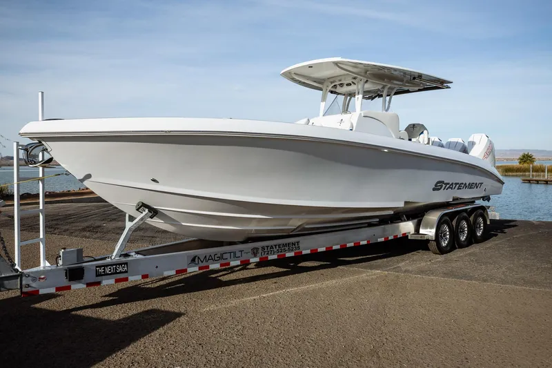 Slide: The Image of 2026 Statement 350 Open boat on trailer by the water. - 5