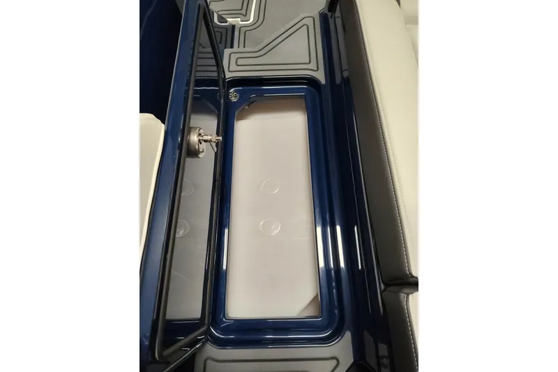 Slide: The Image of 2026 Cobalt R6 Surf boat storage compartment with sleek blue and white design. - 22
