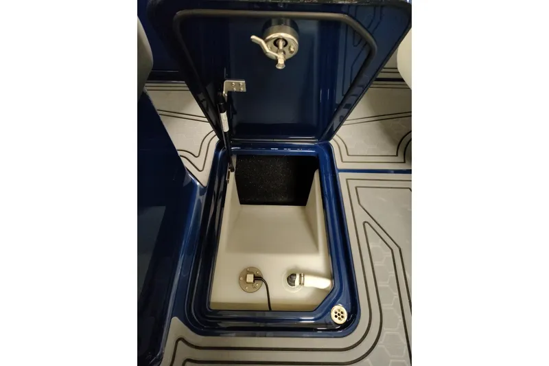 Slide: The Image of Open storage compartment in 2026 Cobalt R6 Surf boat, featuring sleek design and modern fittings. - 23