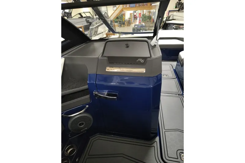 Slide: The Image of 2026 Cobalt R6 Surf boat interior with sleek dashboard and modern design. - 24