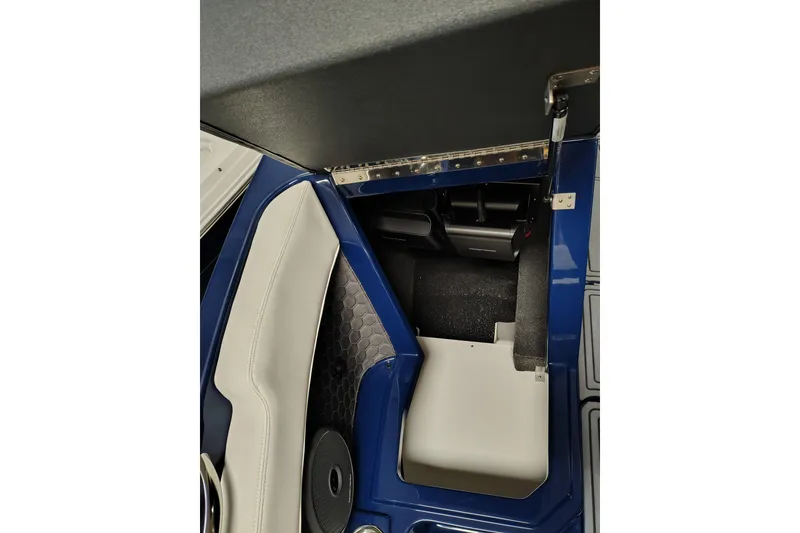 Slide: The Image of 2026 Cobalt R6 Surf interior detail with blue and white seating and storage compartment. - 5