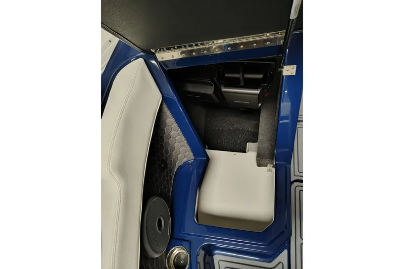 Slide: The Image of Interior view of 2026 Cobalt R6 Surf boat, featuring blue and white seating and storage area. - 8