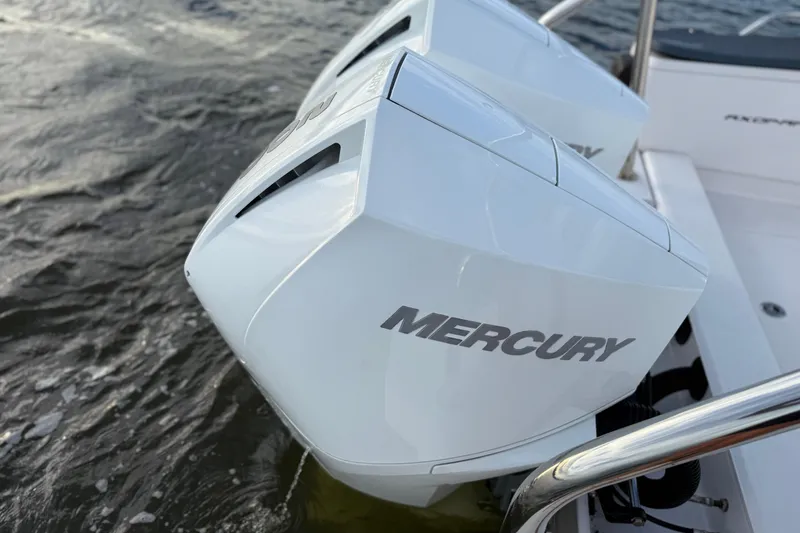 Slide: The Image of Twin Mercury outboard engines on a 2022 Axopar 28 Cabin boat. - 8