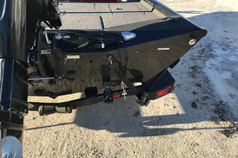 Slide: The Image of 2018 Ranger RT178 boat trailer hitch and rear view on sandy ground. - 14