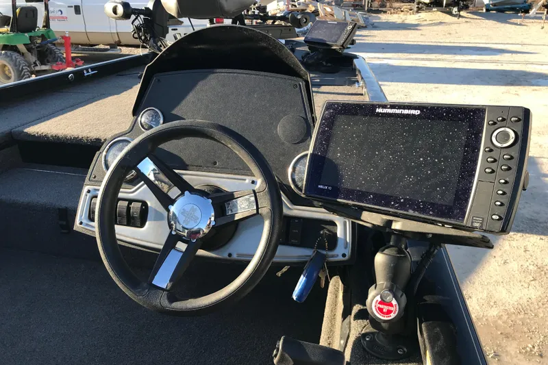 Slide: The Image of 2018 Ranger RT178 boat dashboard with steering wheel and Humminbird Helix 10 fish finder. - 3