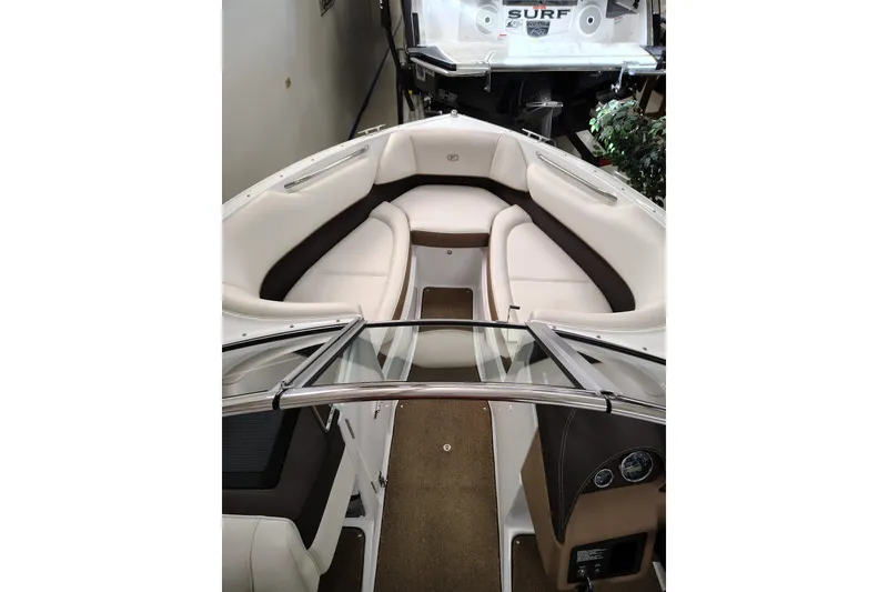 Slide: The Image of Interior view of 2016 Cobalt 220 boat with white and brown seating. - 11