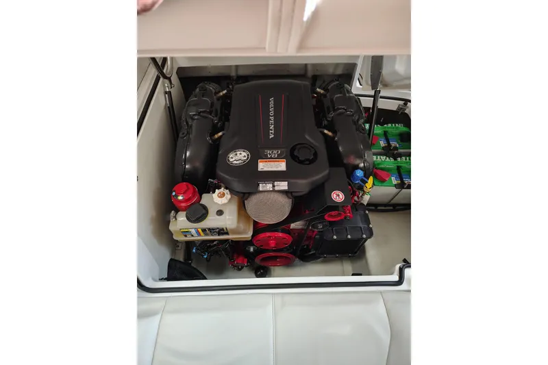 Slide: The Image of 2016 Cobalt 220 boat engine compartment with Volvo Penta engine. - 14