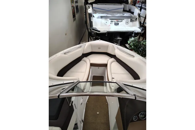 Slide: The Image of 2016 Cobalt 220 boat interior with white seating and sleek design. - 16