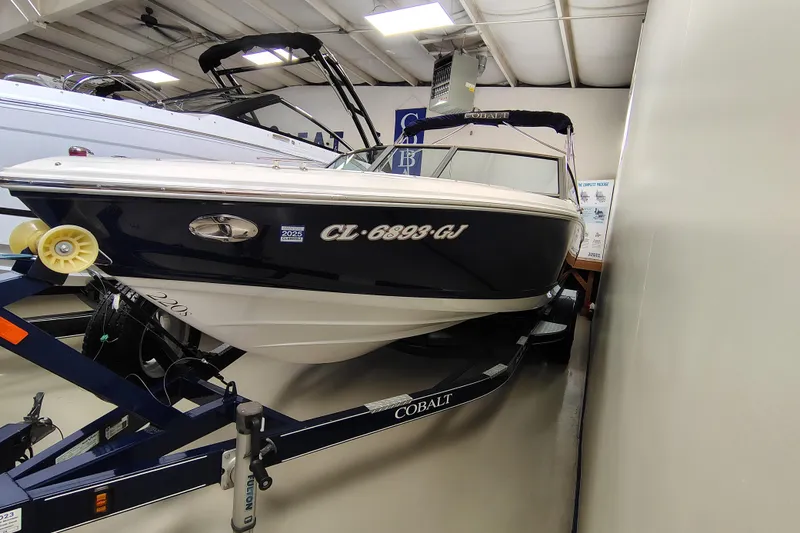 Slide: The Image of 2016 Cobalt 220 boat on trailer in indoor showroom. - 3