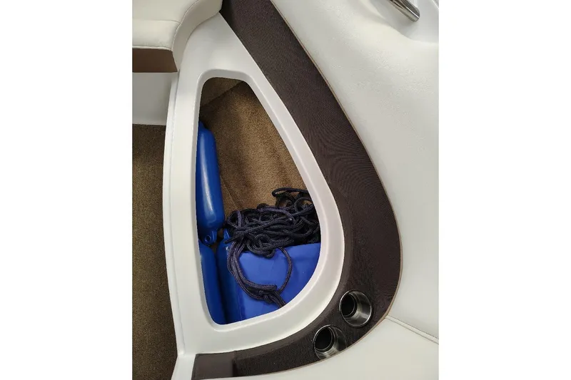 Slide: The Image of Storage compartment in 2016 Cobalt 220 boat with blue fender and rope. - 4