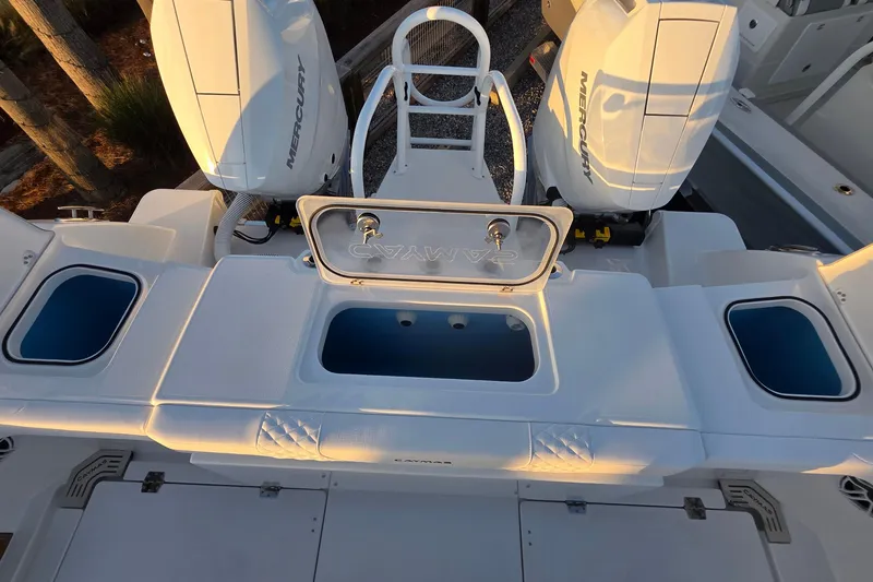 Slide: The Image of 2026 Caymas 34 CT boat with dual Mercury engines and spacious deck layout. - 11