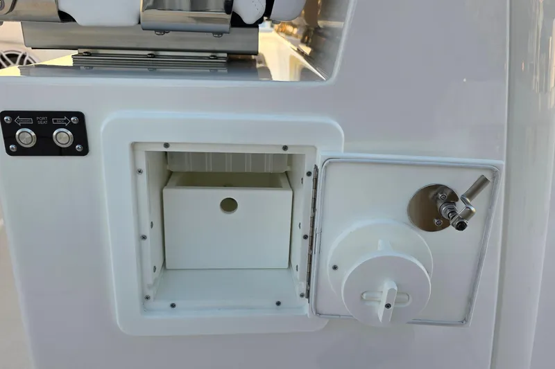 Slide: The Image of 2026 Caymas 34 CT boat compartment with control panel and valve. - 20
