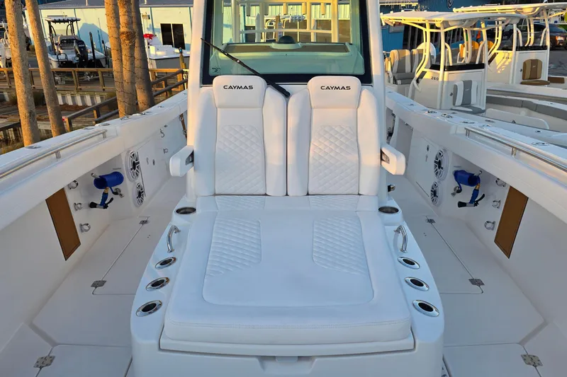 Slide: The Image of 2026 Caymas 34 CT boat interior with white seating and modern design. - 23